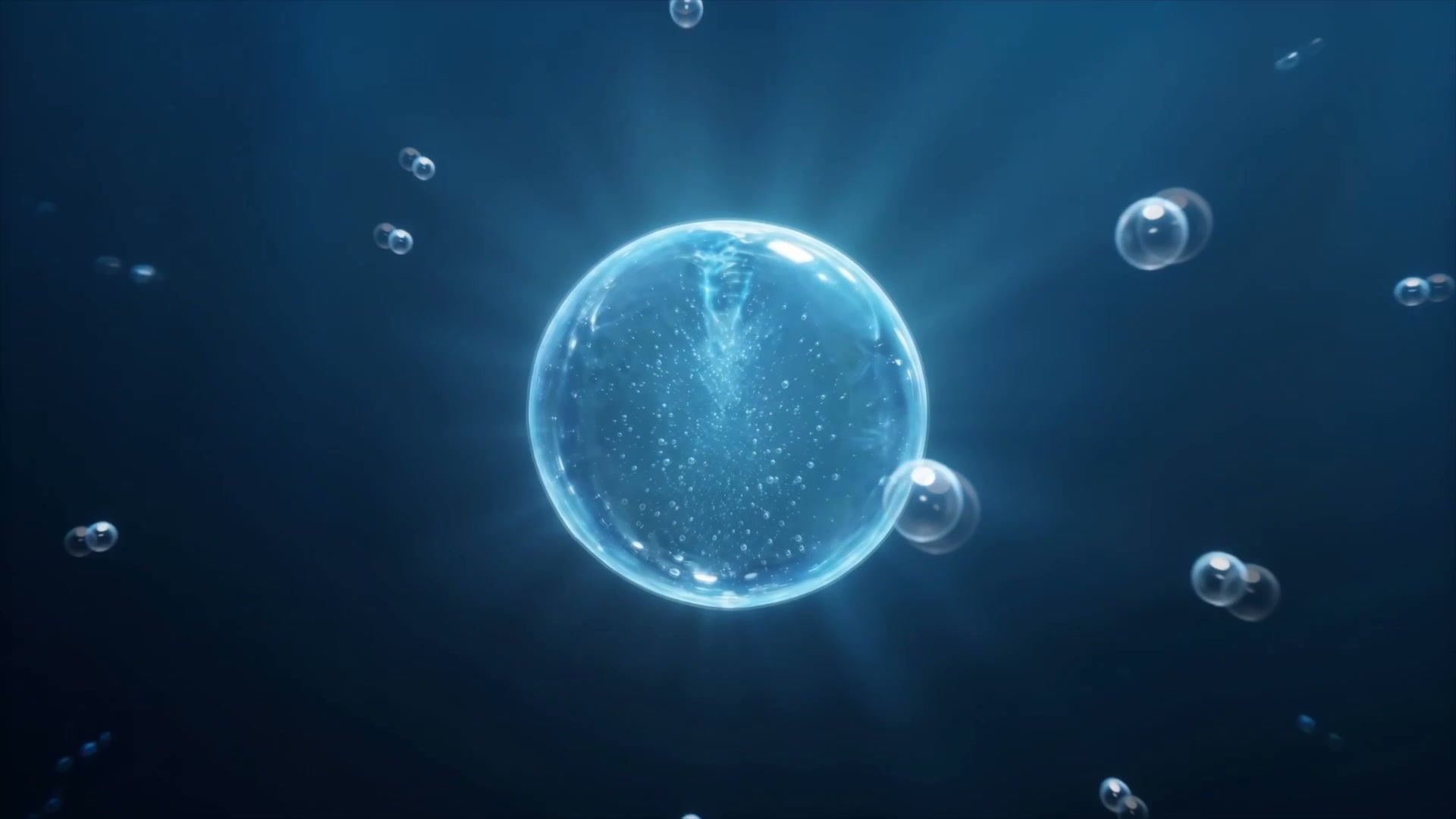 A luminous blue bubble suspended in deep blue water, surrounded by smaller rising bubbles.